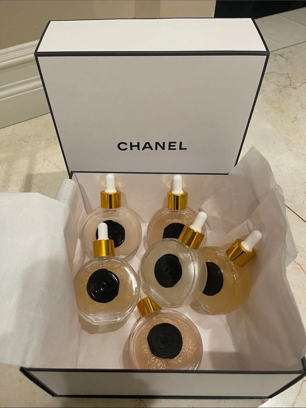 CHANEL Illuminating Shimmering Body Oil Fragrance Drop Bottles.